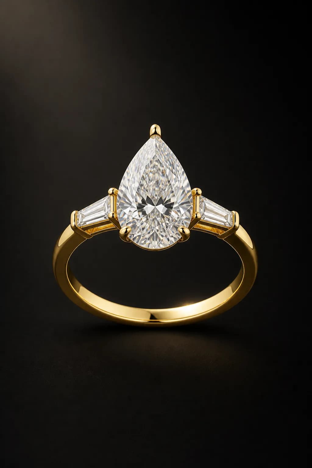 Mira pear laboratory-grown diamond three-stone ring in 18k yellow gold, centered front demonstration view